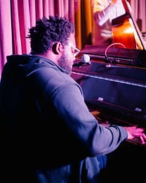 A pianist is playing and singing in a Shoreditch venue