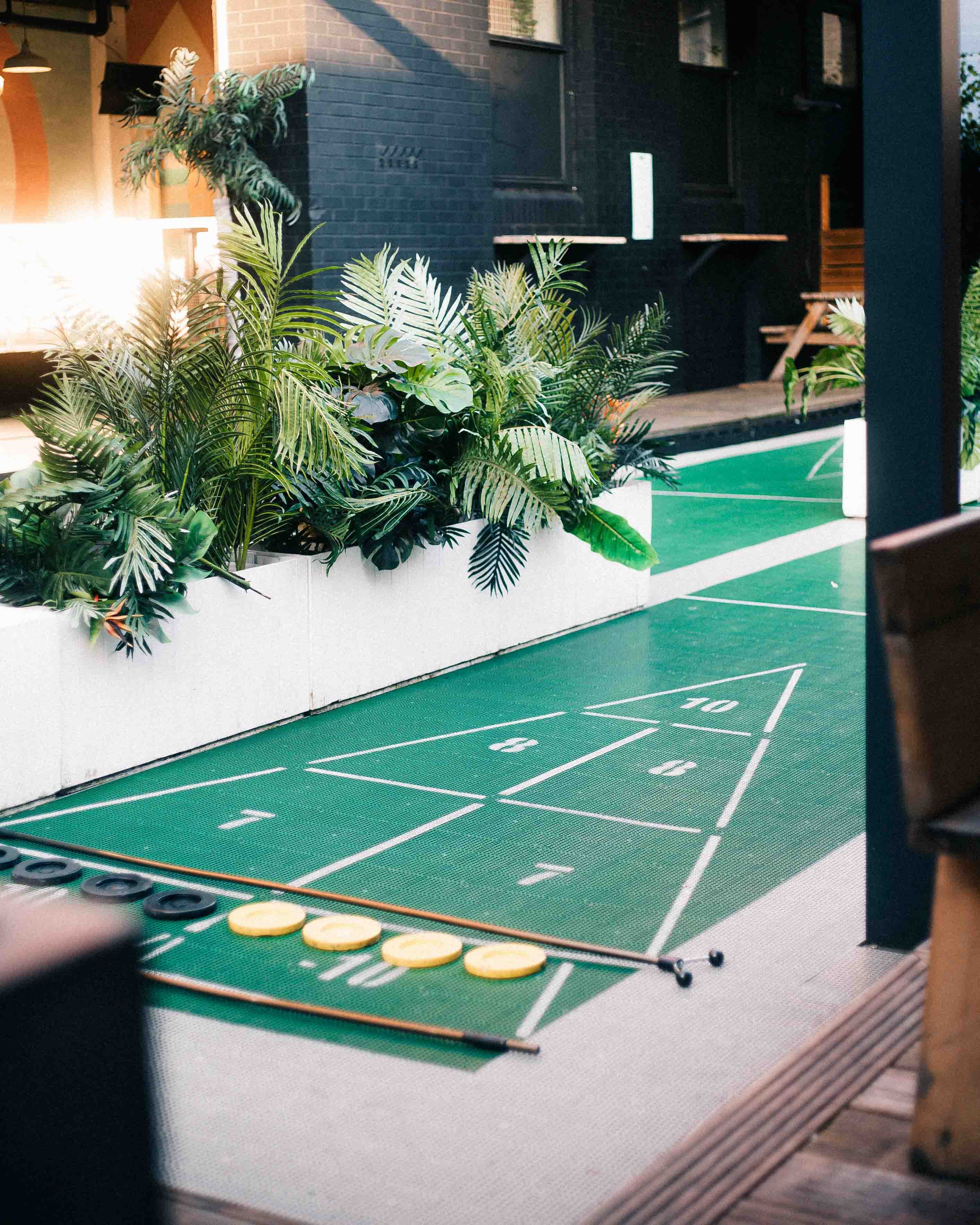 In the heart of vibrant Shoreditch, outdoor bars and shuffleboard await at London Shuffle Club image 2