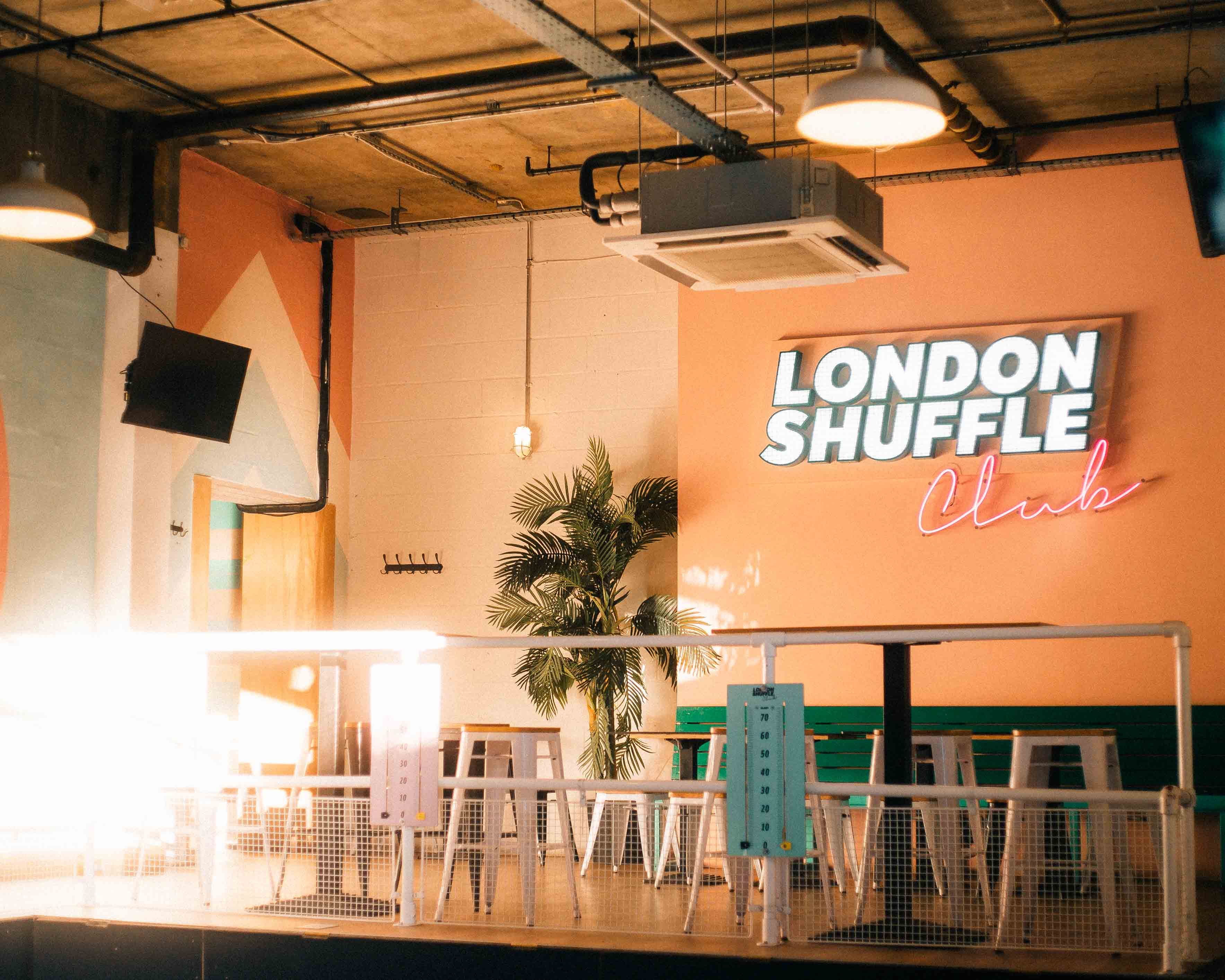In the heart of vibrant Shoreditch, outdoor bars and shuffleboard await at London Shuffle Club1