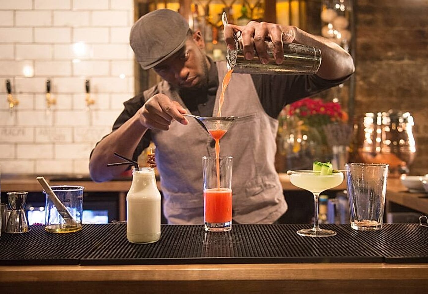 A bartender mixing drinks at Dirty Dicks, a pub near Liverpool Street