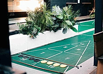 A Shoreditch shuffling pitch with greenery