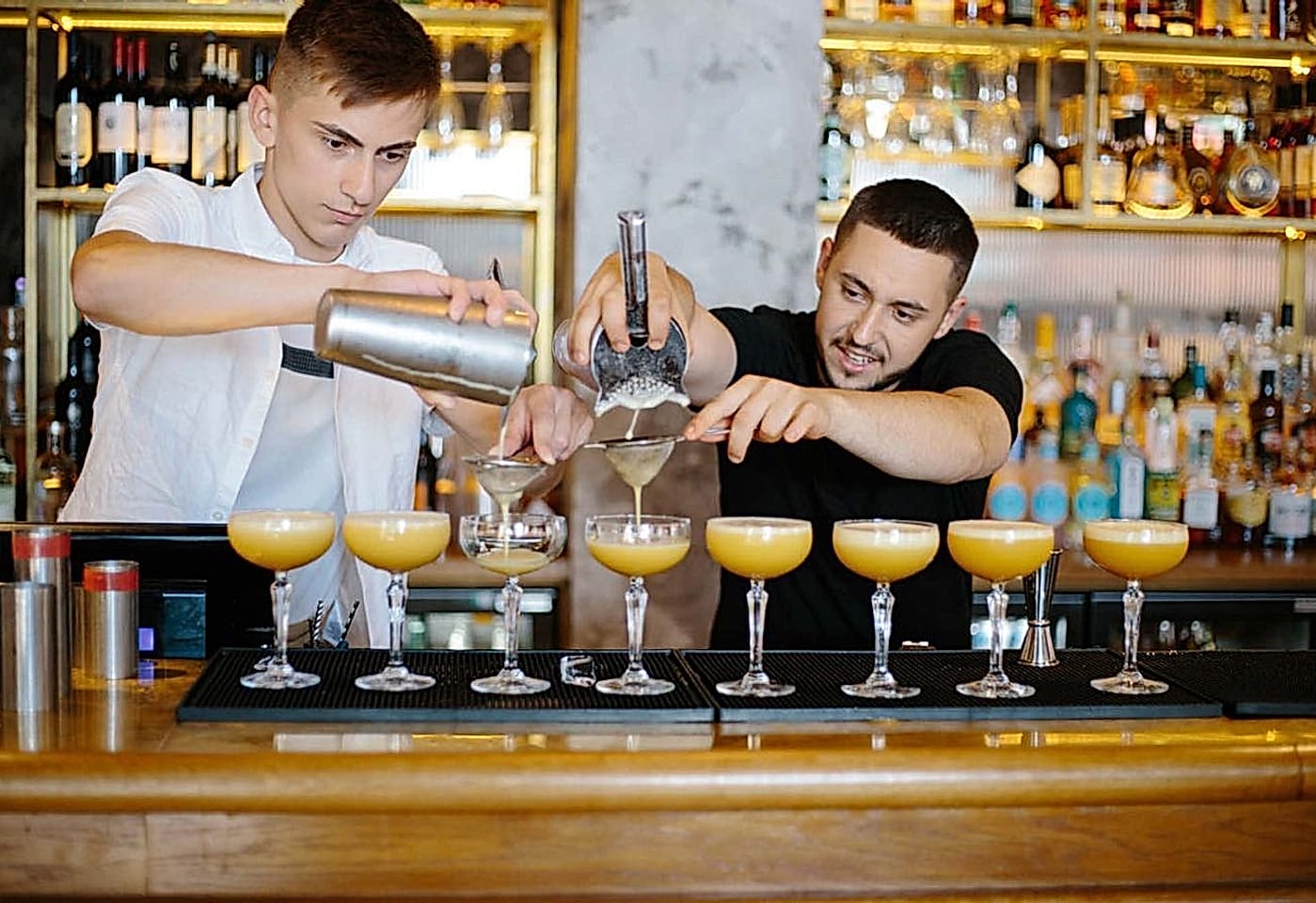 Bartenders making cocktails at Fleets, a bar in the St Pauls district of London