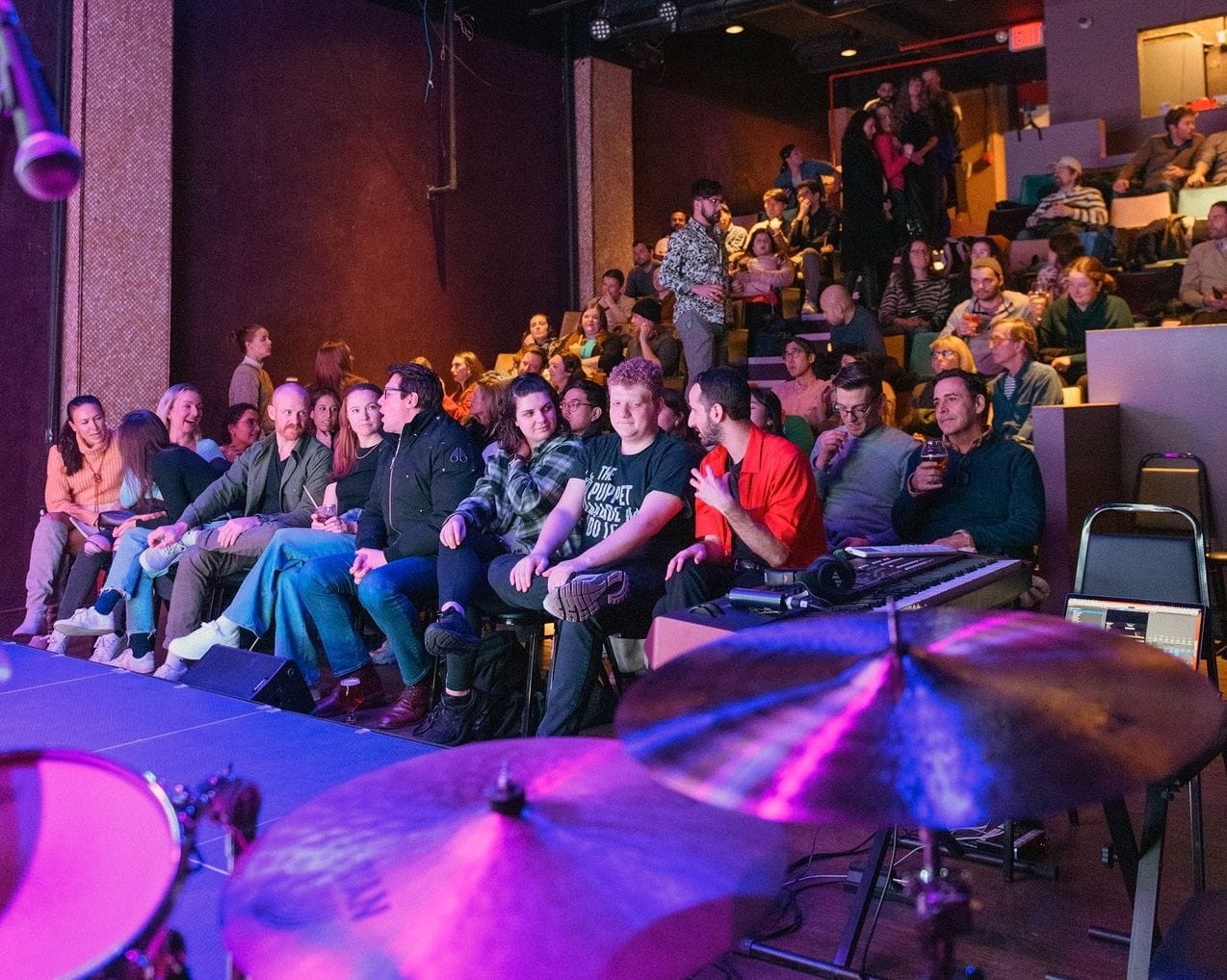 People enjoying a show at Asylum NYC, a comedy club in the city. 