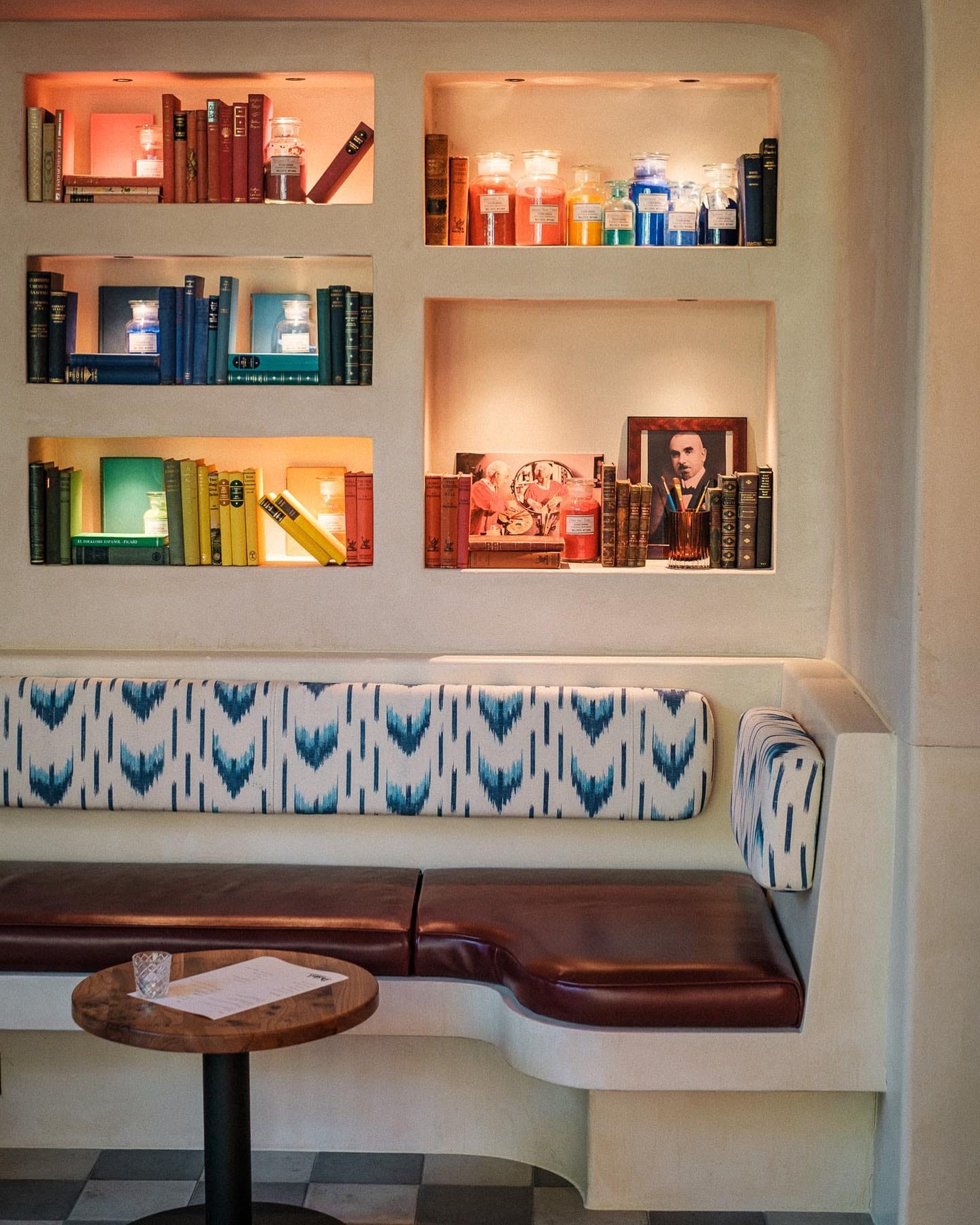 rainbow-themed shelves in London Bridge bar Bar Daskal