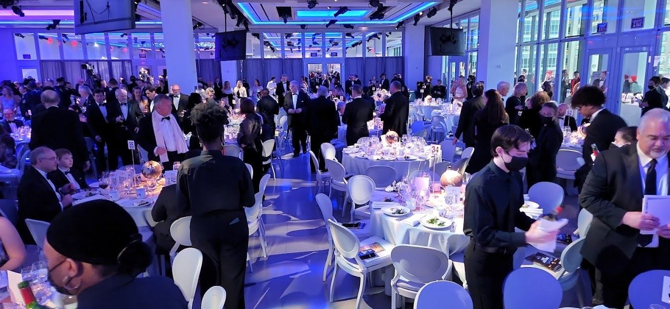 People celebrating at The Glasshouse, a graduation party venue in NYC.