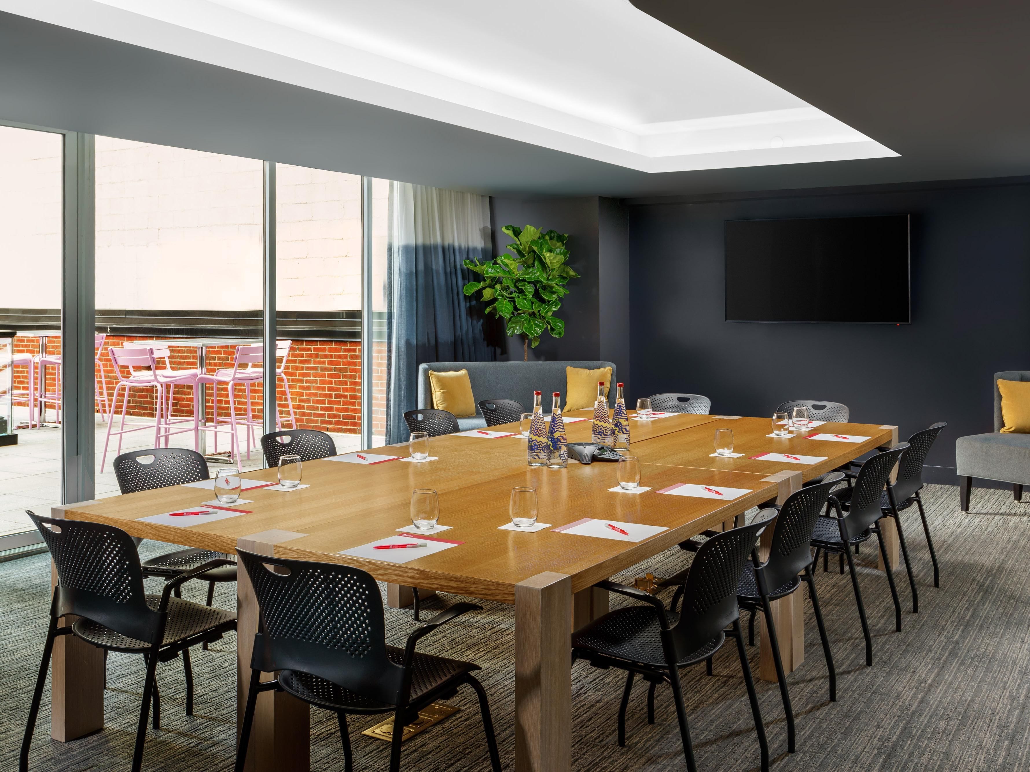 A sleek meeting space with an outdoor terrace: Hotel Indigo1