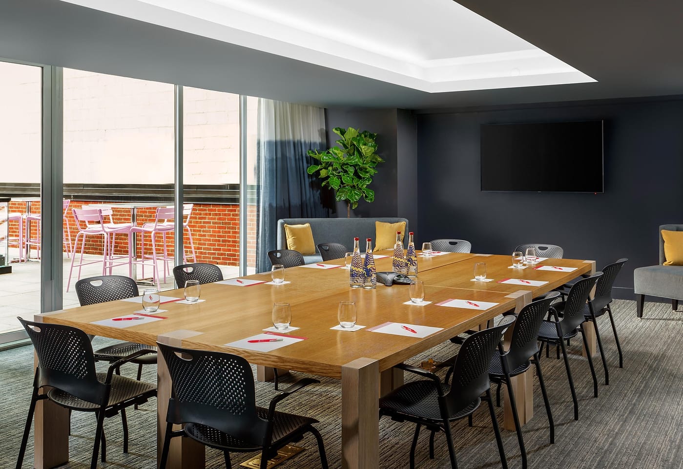 A sleek meeting space with an outdoor terrace: Hotel Indigo1