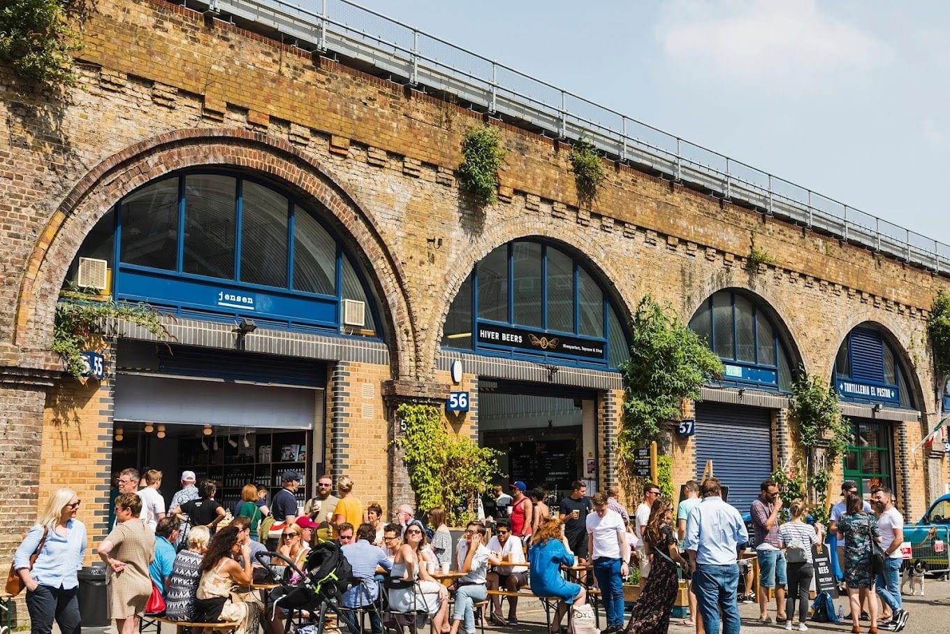 people seated outside jensens at the bermondsey distillery in bermondsey london