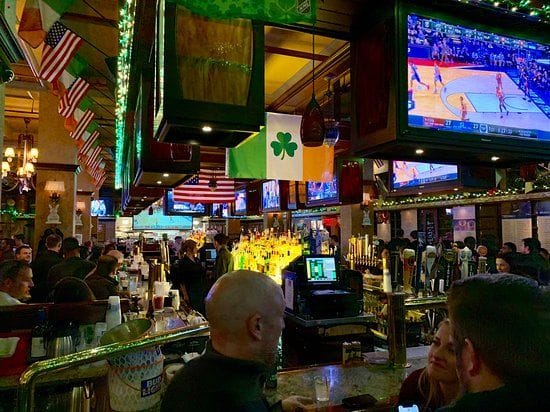 People watching sports games at The Keg, a sports bar in NYC.