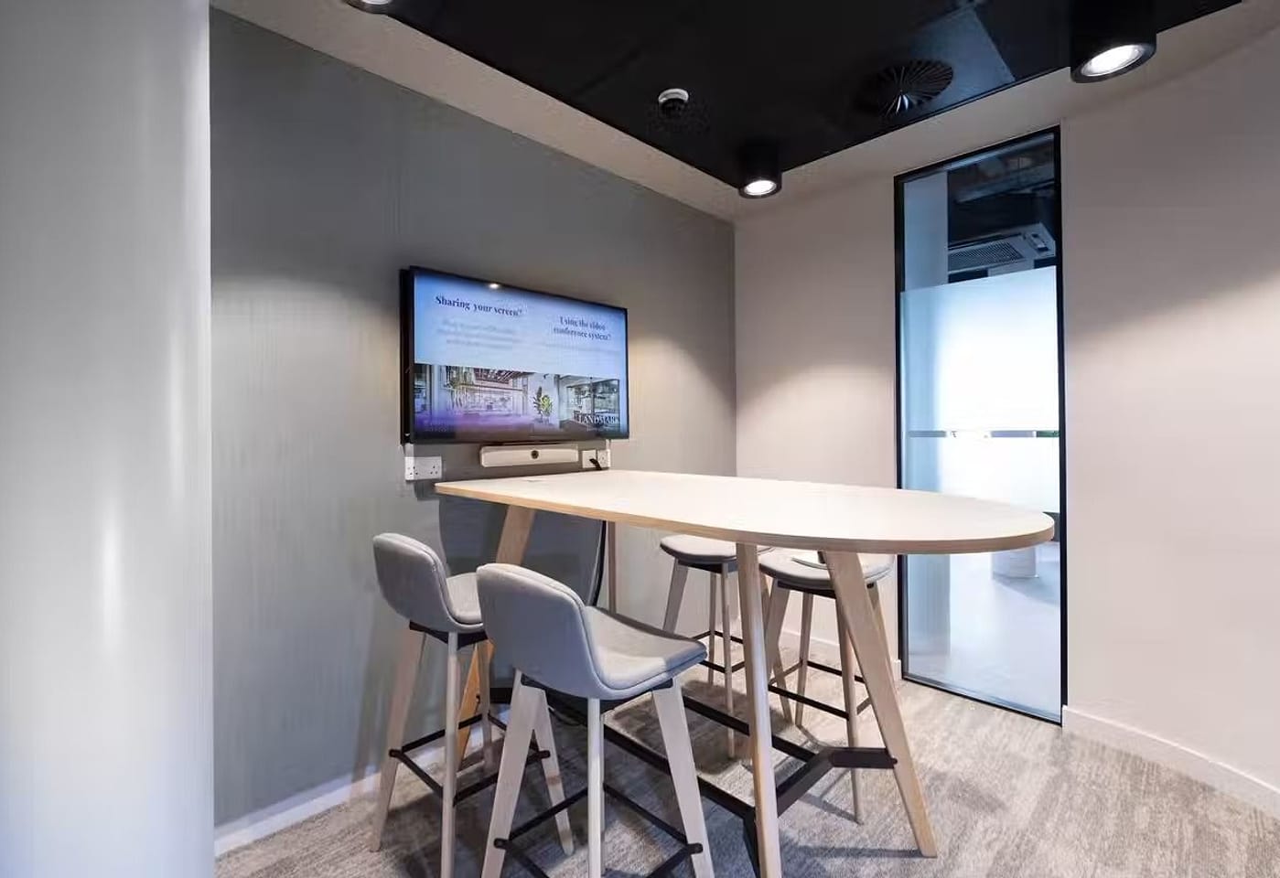 A small meeting room with stools, in Kings Cross, central London