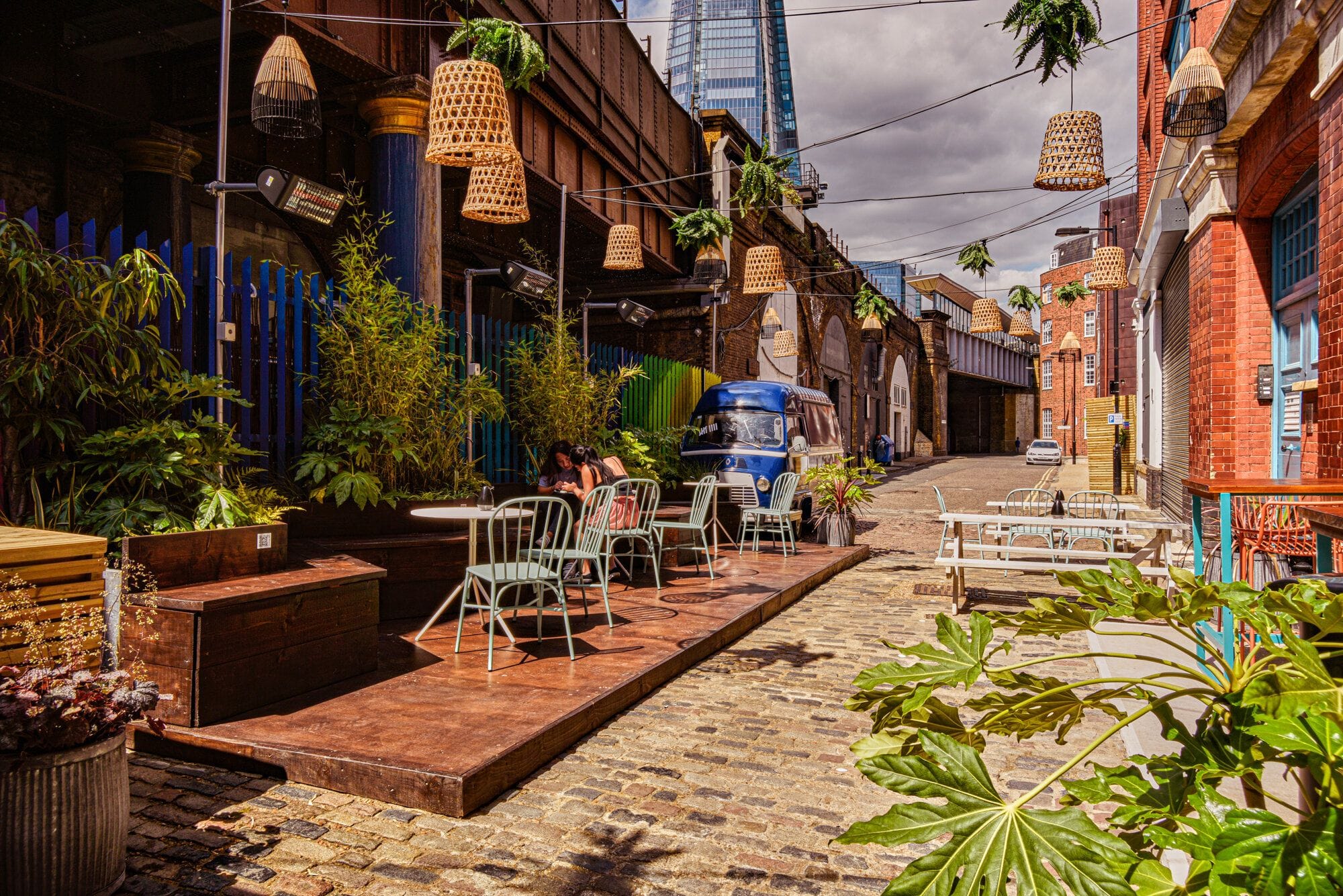 street seating outside nine lives cocktail bar in bermondsey london