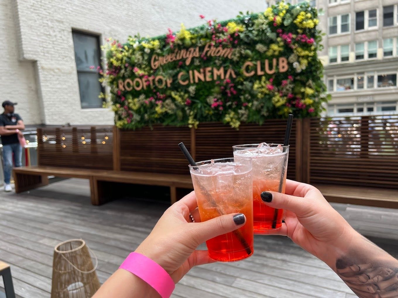 Drinks at Rooftop Cinema Club Midtown, a unique party venue in NYC.