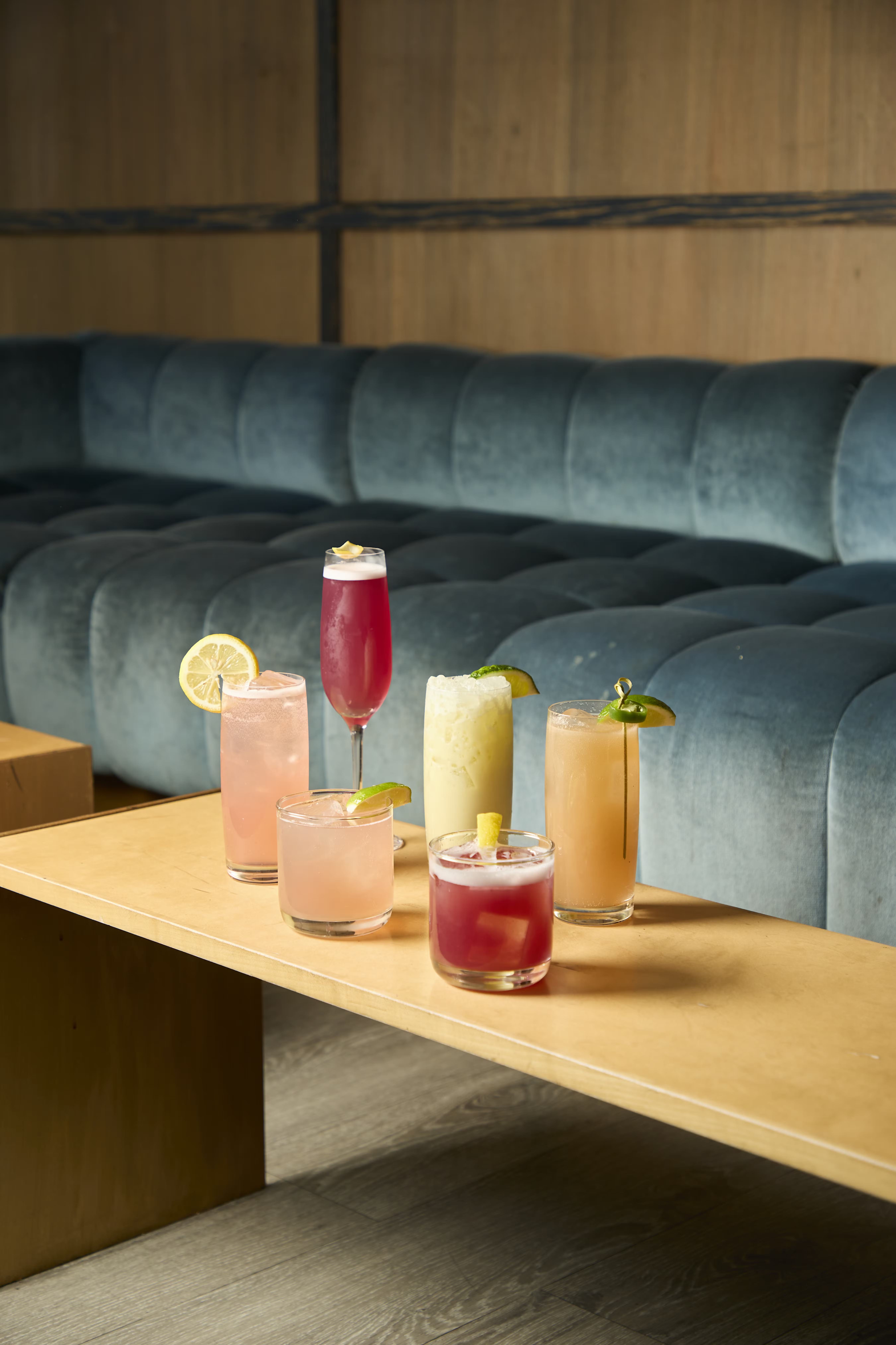 A showcase of colorful alcoholic drinks at The Skylark, a bar for celebrating 21st birthdays in New York. 