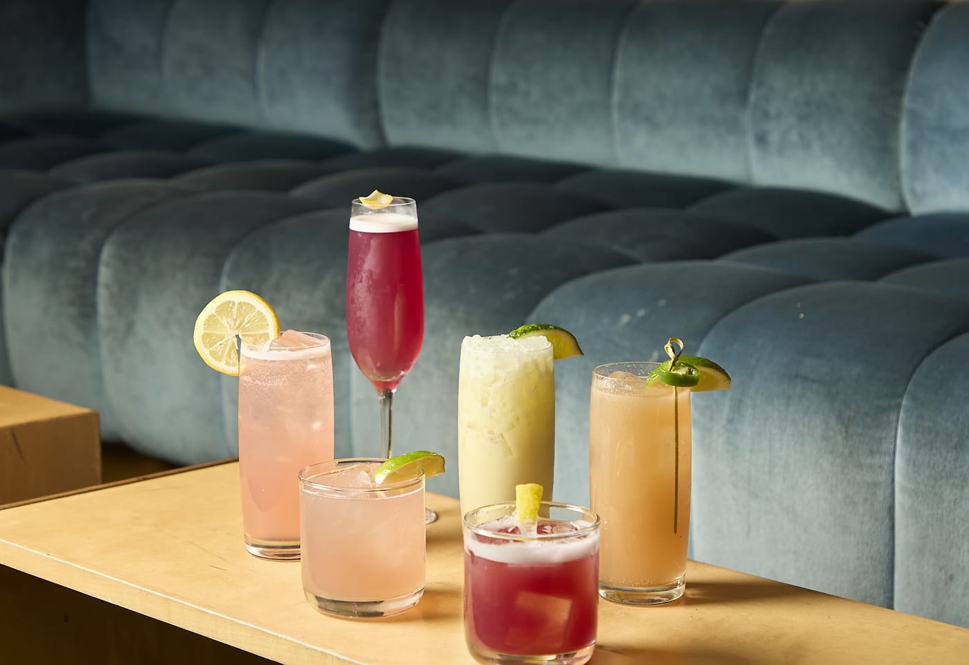 A showcase of colorful alcoholic drinks at The Skylark, a bar for celebrating 21st birthdays in New York.