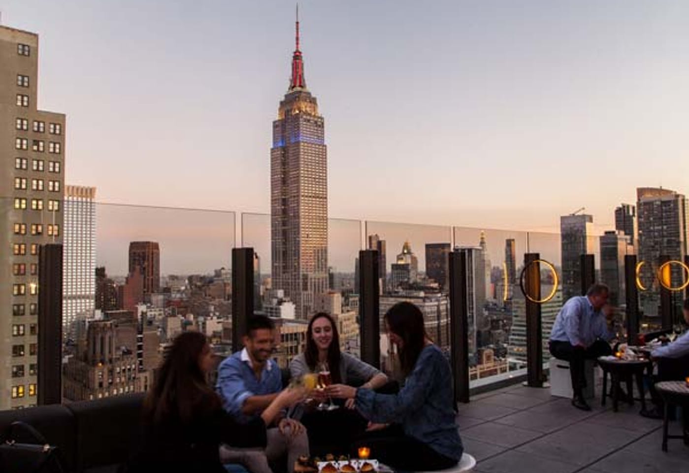 An outdoor terrace with views of the Empire State Building at The Skylark, a bar for celebrating 21st birthdays in New York.