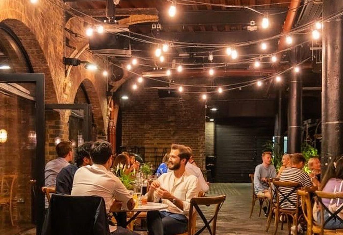 people at the drop wine bar in kings cross london