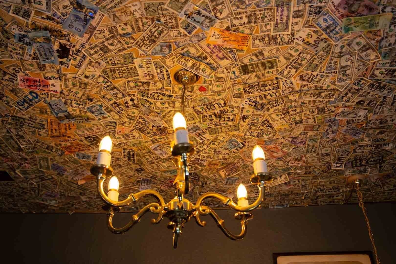 ceiling of money at grenadier belgravia london bar