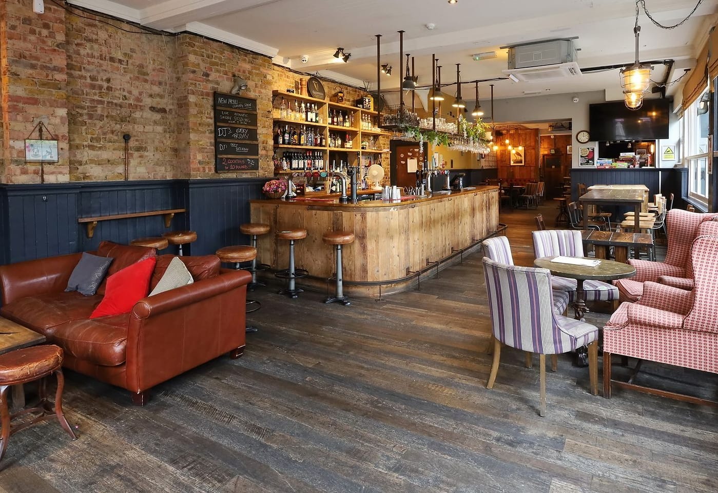 interior of the pocket watch pub in shepherds bush london bar