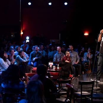 People enjoying a show at The Stand, a comedy club in NYC. 