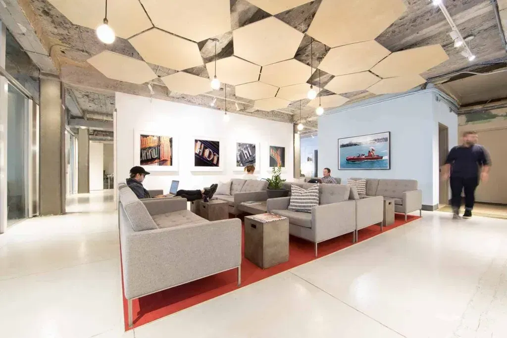 People working on couches at The Yard, a conference venue on the Lower East Side in NYC.